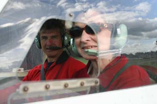 picture of mark and martine sat in the cockpit