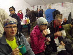 (Picture of the tired team during a quick rest at shelve - with 23 miles to go.) 